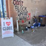 Woman creating wall art