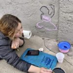 Woman drawing wall art